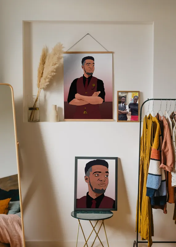 A mockup of two framed cartoon portraits on a wall